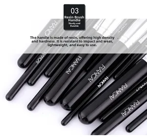 Detail of durable black resin makeup brush handles featuring white brand logo