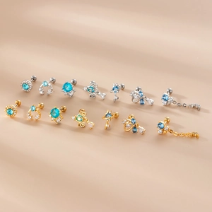 Surgical steel stud earrings set with blue zircon dangles in gold and silver finish