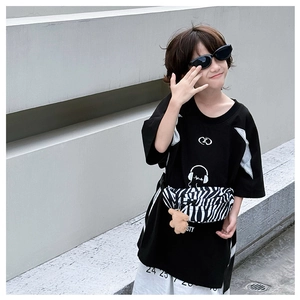 Outdoor street style shot of kids zebra print canvas waist bag with bear pendant