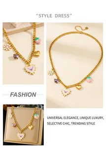 Detailed view of gold chain necklace featuring colorful enamel heart and flower charms