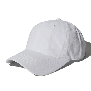 Classic pure white washed cotton baseball cap shown from a sharp side-angle view