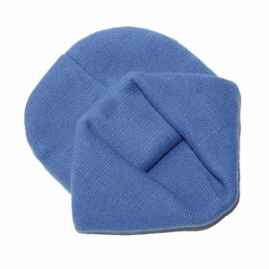 Close-up of bright blue ribbed knit beanie hat showing soft texture and fine stitching