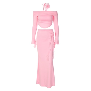 Pink two-piece off-shoulder long sleeve crop top and ruffled maxi skirt set
