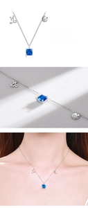 Detail of S925 silver Capricorn necklace featuring blue square stone and zodiac charms