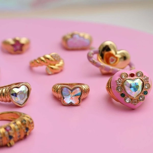 Gold-plated heart and butterfly rings with opal stones and sparkling crystals