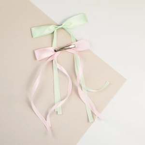 Elegant satin bow hair clips in mint green and pink for women's hairstyle