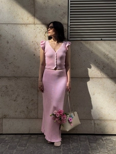 Pink knit two-piece set with V-neck short sleeve top and slim high-waist maxi skirt
