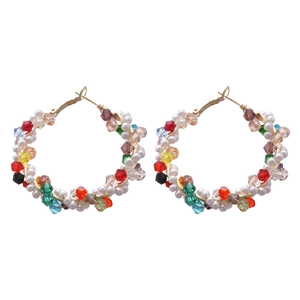 Elegant gold hoop earrings with colorful crystal beads and pearls on white background