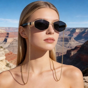 Fashion nylon oversized hexagonal sunglasses with gold chain on model in canyon scenery