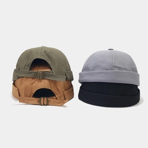 Detail of docker hats with adjustable metal buckle and durable canvas texture in four colors