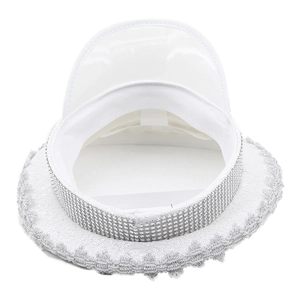 Close-up of white sequined captain hat with silver rhinestones for party performance