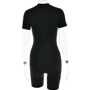 Rear view of tight-fitting black short-sleeved bodysuit with high collar on transparent model