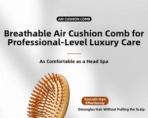 Close-up of bamboo air cushion comb with natural wood teeth for scalp massage and care