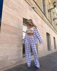 Fashionable two-piece set with black geometric prints on white shirt and wide-leg trousers