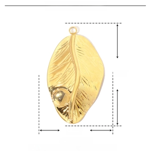 Macro shot of gold stainless steel leaf pendant with size 28mm by 16mm and resin stone detail