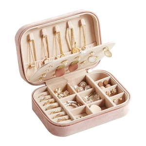 Pink velvet jewelry box with necklace hooks and ring slots for travel storage