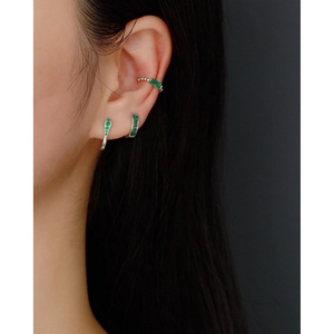 Detailed view of silver S925 U-shaped ear cuffs with green rectangular zircon stones