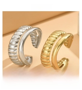 Detail of adjustable double-layer rings with ribbed and smooth stainless steel textures