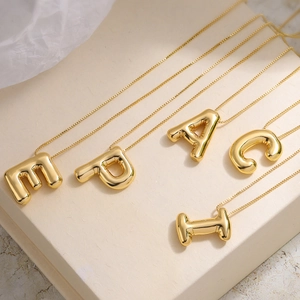 Golden balloon style letter necklaces A C E I P with high-gloss metallic finish