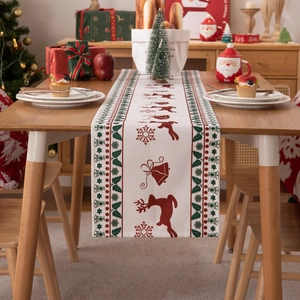 Modern Christmas table runner with festive reindeer and snowflake prints on poly-cotton
