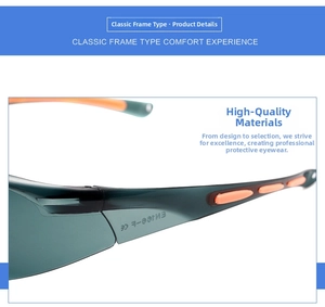 Detail showing the EN166 safety certification mark on green sport safety glasses