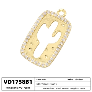Macro detail of gold brass pendant with paved rhinestones and cactus cutout design