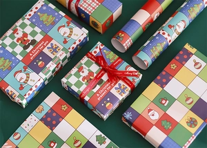 Close-up of festive Christmas gift wrapping paper with colorful cartoon patterns and boxes