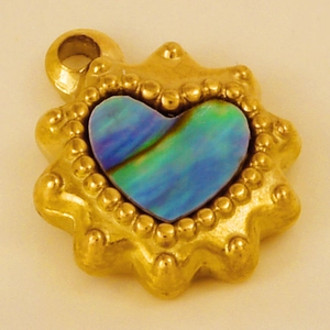 Detail of heart pendant with gold beaded edge and iridescent abalone shell inlay