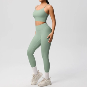 Detail of sage green yoga set with thin straps sports bra and high waist leggings