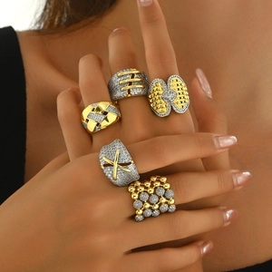 Teardrop rhinestone gold plated rings set with woven and crisscross designs for women