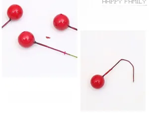 Close-up of vibrant red artificial berries with glossy glaze for DIY floral arrangements