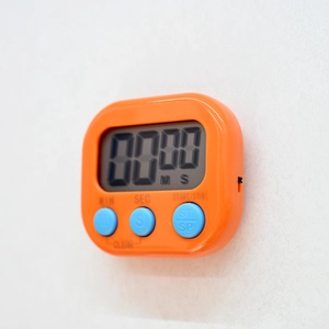 Detail of orange digital timer with blue buttons and clear LCD display screen