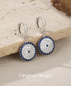 Detail shot of S925 sterling silver evil eye hoop earrings with blue stones and S925 stamp