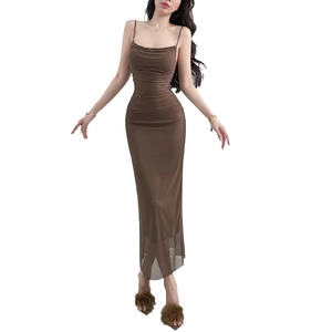 Detail of brown mesh ruched bodycon dress with adjustable straps and sheer fishtail hem