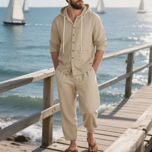 Men's loose sandy beige linen hooded shirt and pants beach set with wooden deck backdrop