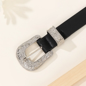 Vintage black leather belt featuring an intricate engraved silver buckle in Western style