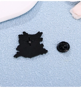 Close-up of black metal butterfly clutch back and pin for cartoon enamel pins