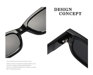 Detail view of black rectangular sunglasses featuring reinforced metal hinges and frame texture
