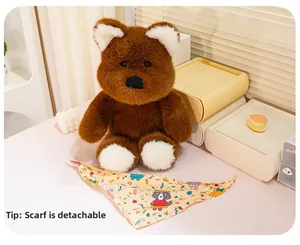 Detail of plush brown bear toy featuring a removable yellow floral bandana in a warm setting