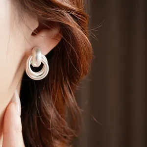 Matte silver triple interlocking hoop earrings for women in a minimalist geometric style