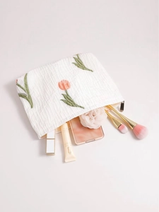 Floral tulip embroidered cosmetic bag with white pleated texture and zip closure