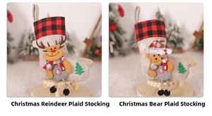 Detail of Christmas burlap stockings with elk and bear characters and red plaid cuffs
