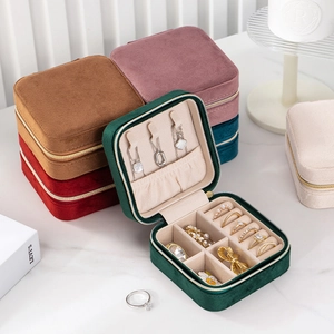 Detailed view of velvet jewelry box interior showing necklace hooks and ring slots