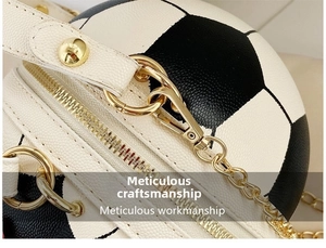 Close-up of football-shaped crossbody bag with gold zippers and textured faux leather