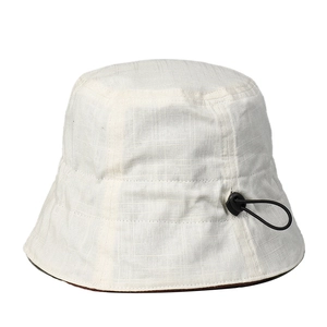 Reversible linen bucket hat with drawstring for sun protection in cream and brown