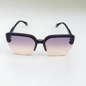 Detailed macro view of trendy semi-rimless sunglasses with purple gradient lenses