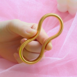 Flexible golden titanium steel spring bracelet with spiral metal texture for women and men