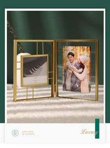 Detail of a luxury gold metal folding picture frame with 4x4in square and portrait slots