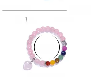 Detail view of 8mm natural crystal beaded bracelet with dimensions and colorful heart charm