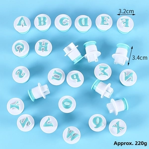 Detail view of 26-piece alphabet cookie cutters with spring press for fondant baking